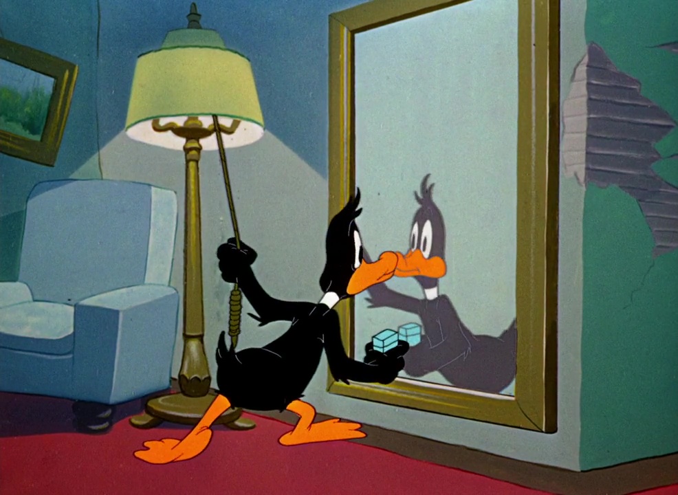 Daffy Duck sees himself in the mirror